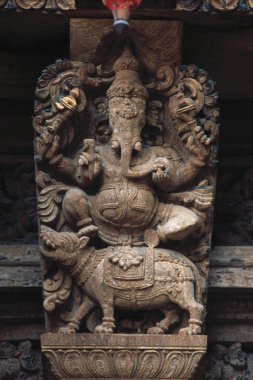 Lord Ganesh ganpati statue 350 year old woode carving in sree meenakshi temples chariot ; madurai ; tamil nadu ; india  clipart