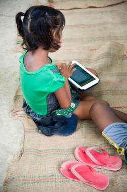 Girl studying on tablet, varanasi, uttar pradesh, india, asia 