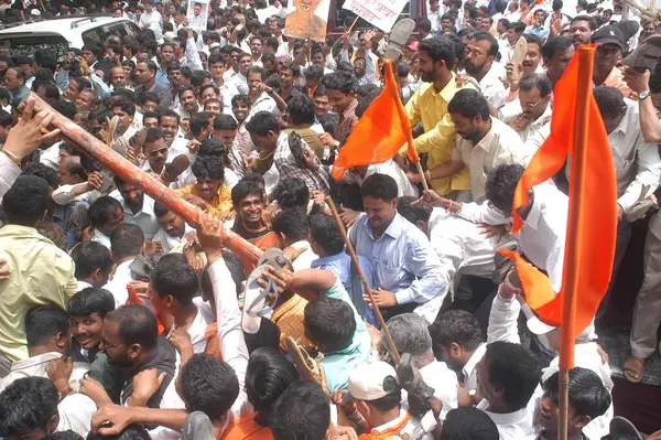 stock image Large number Shiv Sainiks members of Shiv Sena political party holding flags gathered at Shivaji Park in Dadar, Bombay Mumbai, Maharashtra, India 