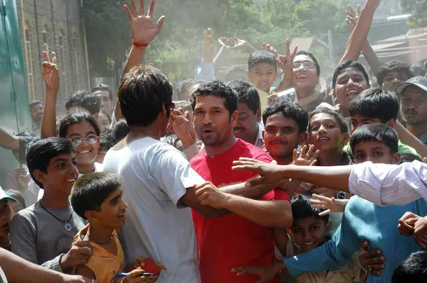 stock image Indian cricket star Sachin Tendulkar is surrounded by his fans, Bombay now Mumbai, Maharashtra, India   