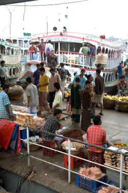 Cruise boat and market at Sadarghat Boat terminal, Dhaka, Bangladesh  clipart