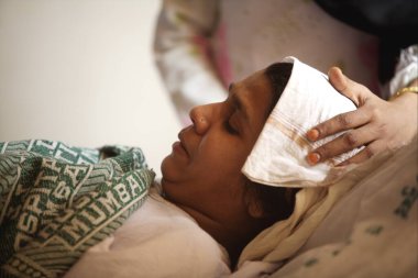 Victim of terrorist attack by Deccan Mujahedeen on 26th November 2008 treated in J.J. hospital in Bombay Mumbai, Maharashtra, India   clipart