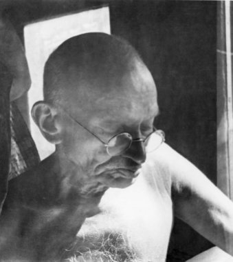Close_up of Mahatma Gandhi sitting in a train, 1945, India    clipart