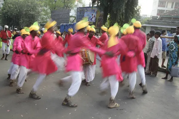 Stock image Adivasi from Mokhada performing tribal dance during the religious procession at Court Naka, Thane, Maharashtra, India,   