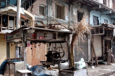 Shops damaged by powerful explosives site of bomb blast at Zaveri Bazaar in busy Kalbadevi area ; Bombay Mumbai ; Maharashtra ; India on August 26th 2003 clipart