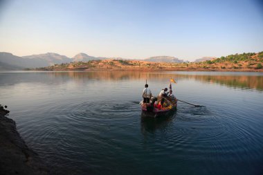 Fishermen fishing in Bhandardara lake Maharashtra India Asia  clipart