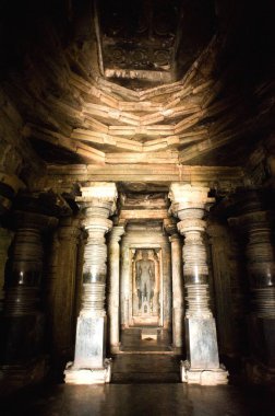 Shantinathas statue and garbhgruha at jain bastis, Halebid Halebidu, Hassan, Karnataka, India  clipart