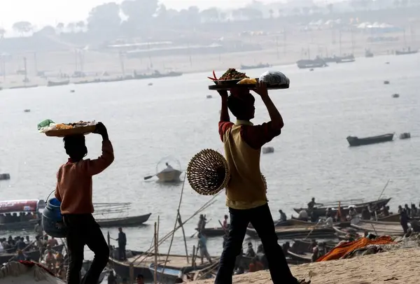 stock image A hawker sells eatables at the confluence of the Ganges, Yamuna the mythical Saraswati rivers during the Ardh Kumbh Mela, ,, India 