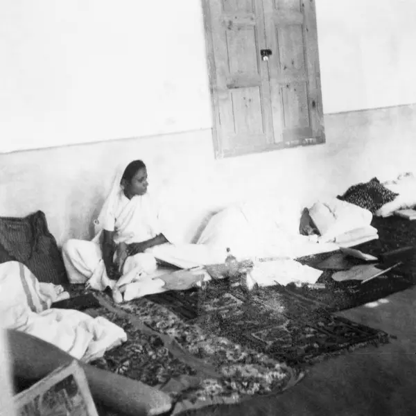 stock image Amtus Salam massaging Mahatma Gandhis feet during his visit to the North West Frontier Provinces to Afghanistan , October 1938