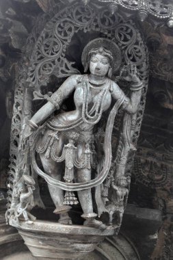 Bracket statue of dancer at Channakesava temple, Belur, Karnataka, India  clipart
