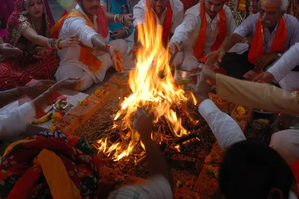 stock image Several people performing Havan sitting around fire Jodhpur Rajasthan India 