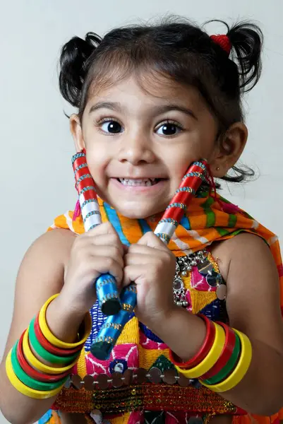 stock image Young girl with dandiya on navratri garba festival