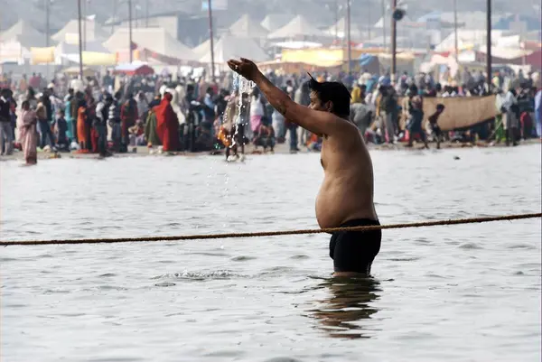 stock image Pilgrims gather at the confluence of the Ganges, Yamuna and the mythical Saraswati rivers to take a holy dip during the Ardh Kumbh Mela, one of the worlds largest religious festivals at Allahabad, Uttar Pradesh, India 