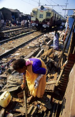 Slum near Railway Track, Mumbai, Maharashtra, India clipart