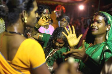 Eunuchs dressed in finery dancing during wedding of eunuchs on occasion of Bewa Purnima at Ghatkopar, Bombay now Mumbai, Maharashtra, India  clipart