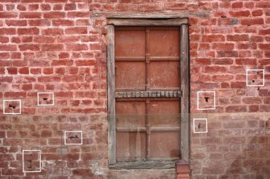 Kurşun izleri Jalianwala Bagh, Amritsar, Punjab, Hindistan 'da korunmuş tuğla duvarda görülüyor.