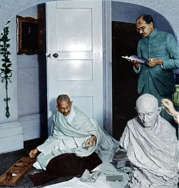 Stock image Mahatma Gandhi spinning and talking to Mahadev Desai, October 22, 1931