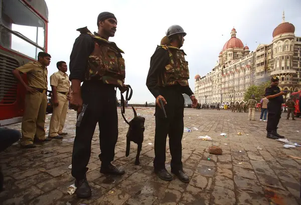 stock image National Security Guards NSG commandoes with dogs and police personnel outside Taj Mahal hotel after killing terrorists, Bombay Mumbai, Maharashtra, India  