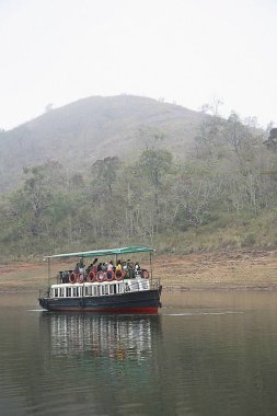 Tourists on Boat at Periyar lake, Periyar wildlife sanctuary, Thekkady, Kerala, India  clipart