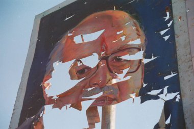 Torn poster of L.K. Advani leader of Indias opposition Bhartiya Janta Party, India    clipart