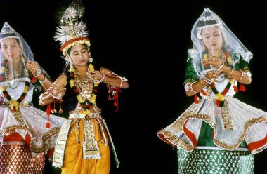Manipuri Folk Dance, women performing classical dance of india    clipart