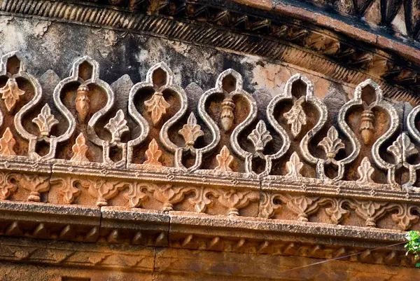 stock image A mosque of Adilshai times, gumbaz at lower level, officer Abdul Aziz raised arch in memory of his wife, Badami, Karnataka, India  