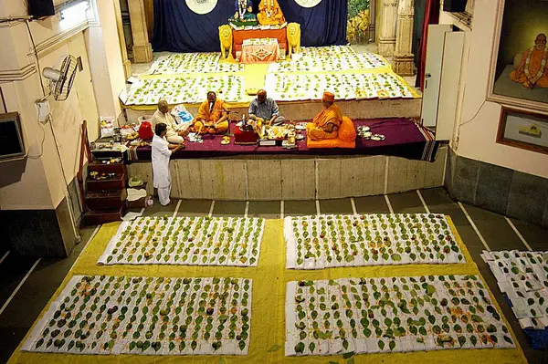 stock image Swaminarayan priests performing chopadi puja ritual performed on lakshmi puja, Bombay Mumbai, Maharashtra, India 
