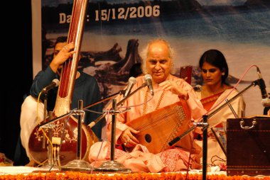 Musician Padma Vibhushan Sangeet Martand Pandit Jasraj playing Swar Mandal, Bombay Mumbai, Maharashtra, India clipart
