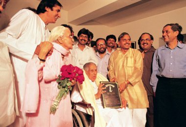 South Asian Indian poet Harivanshrai Bachchan being honored by UP Chief Minister Mulayam Singh Yadav at a function in his house 