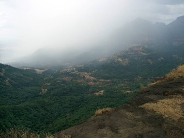 Misty landscape at Malshej 200 kms, Bombay Mumbai, Maharashtra, India  clipart