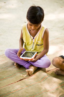 Boy studying on tablet, varanasi, uttar pradesh, india, asia 