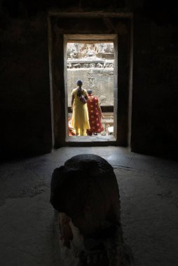 Tourists in Kailash temple at Ellora caves, Aurangabad, Maharashtra, India  clipart