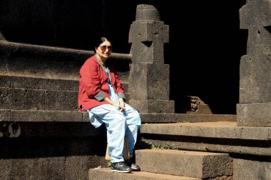 Old lady at Krishna Bai Hindu temple at old Mahabaleshwar  ; Maharashtra  ; India clipart