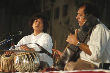 Indian classical music maestros zakir hussain tabla player with ustad sultan khan sarangi player, India     clipart
