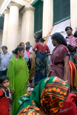 Bengalese Women changing sarees at Babu Ghat, Kolkata, West Bengal, India  clipart