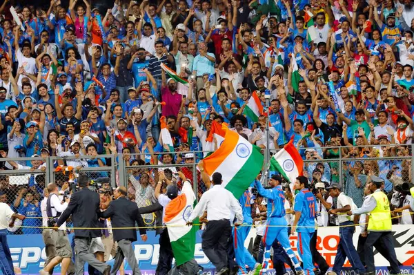 stock image Indian batsman Sachin Tendulkar is carried on the shoulders by his teammates as he waves the tricolour after India defeated Sri Lanka in the ICC Cricket World Cup 2011 final played at the Wankhede Stadium in Mumbai India on April 2 2011