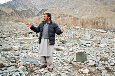 Kargil headman in martyrs cemetery, Leh, Ladakh, Jammu and Kashmir, India 10, April, 2008  clipart