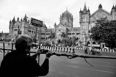Man pulling handcart, Victoria Terminus, VT, Chhatrapati Shivaji Maharaj Terminus, CST, UNESCO World Heritage Site, Bori Bunder, Bombay, Mumbai, Maharashtra, India, Asia clipart