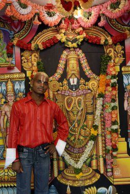 A photographic studio at Tirumalai Tirupati temple town , Andhra Pradesh , India clipart