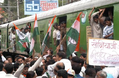 A rail roko at the Ghatkopar station, in the suburbs of Bombay now Mumbai, Maharashtra, India, conducted by the workers of the Indian Congress Party and the Nationalist Congress Party  clipart