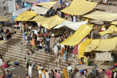 Pilgrims take bath in narmada river at Omkareshwar ; District Khandva ; Madhya Pradesh ; India clipart