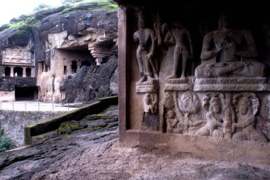 Ellora caves view and statues on wall ; Aurangabad ; Maharashtra ; India clipart