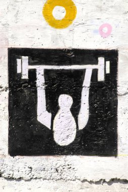 Weightlifting the pictogram of III Commonwealth Youth Game painted on wall of Rajiv Gandhi Zoological park, Katraj, Pune, Maharashtra, India clipart