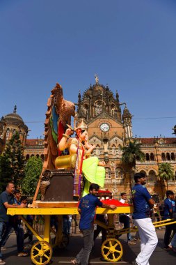 Lord Ganpati idol procession, Ganesh festival, Chhatrapati Shivaji Maharaj Terminus, Mumbai, Maharashtra, India, Asia clipart
