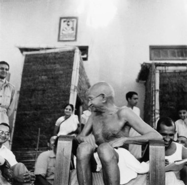 Mahatma Gandhi with soldiers of the Indian National Army at Bhangi Colony in Delhi, 1946, India    clipart
