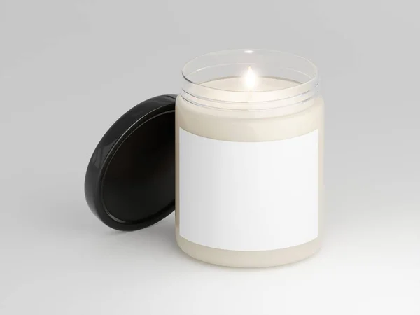 stock image One scented glass lit candle with black lid ans blank label for your design isolated on a plain white background