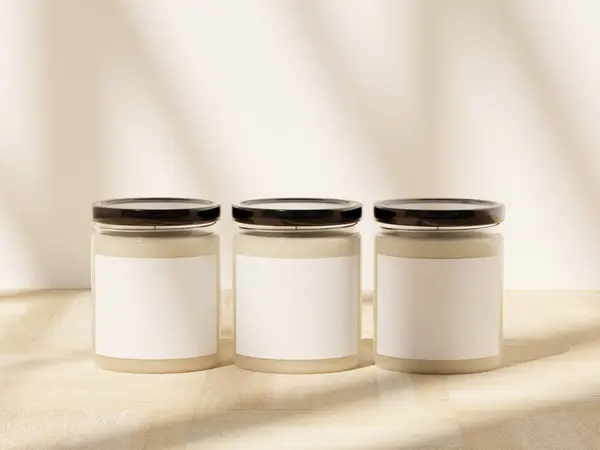 Three 9 oz scented soy candle jars soft window shadows on a wooden surface. Blank label space for personalization