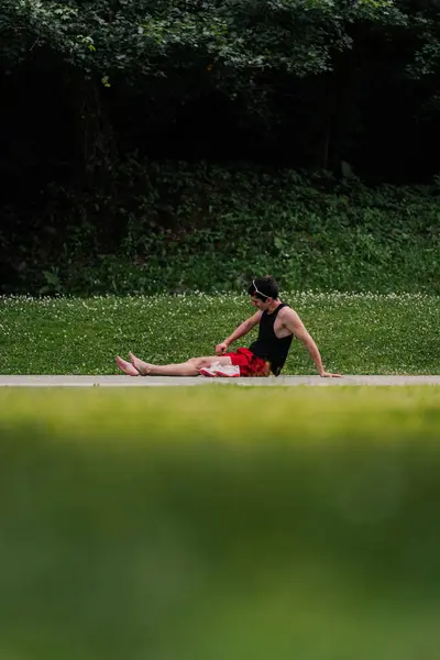 stock image Runner sitting on the ground after a hard and intense training session. 