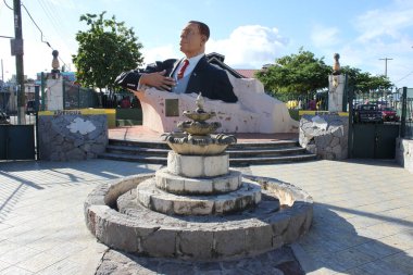St. Johns, Antigua and Barbuda - November 27, 2016: View of the large statue of former Antiguan Prime Minister Sir Vere Cornwall Bird in St John's. First prime minister after independence 1981 clipart