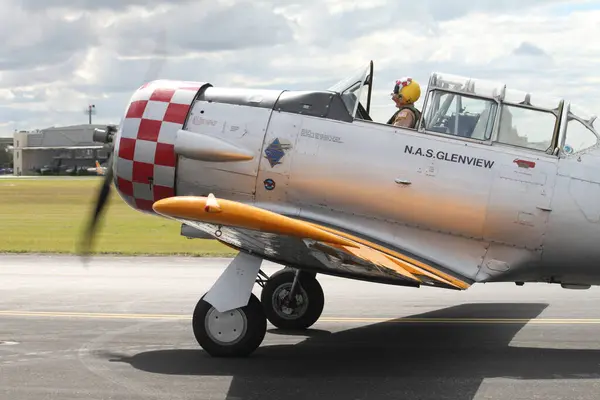 stock image New Orleans, LA, USA, October 27, 2017: Close up of pilot in cockpit of aircraft North American AT-6D Texan Commemorative at runway at New Orleans Lakefront Airport at airshow WWII Air, Sea and Land Festival.